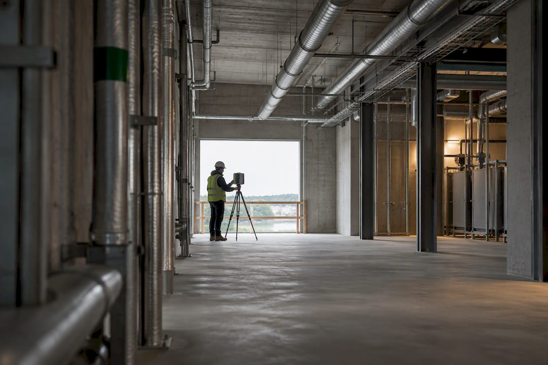 Technician scanning unfinished mechanical room