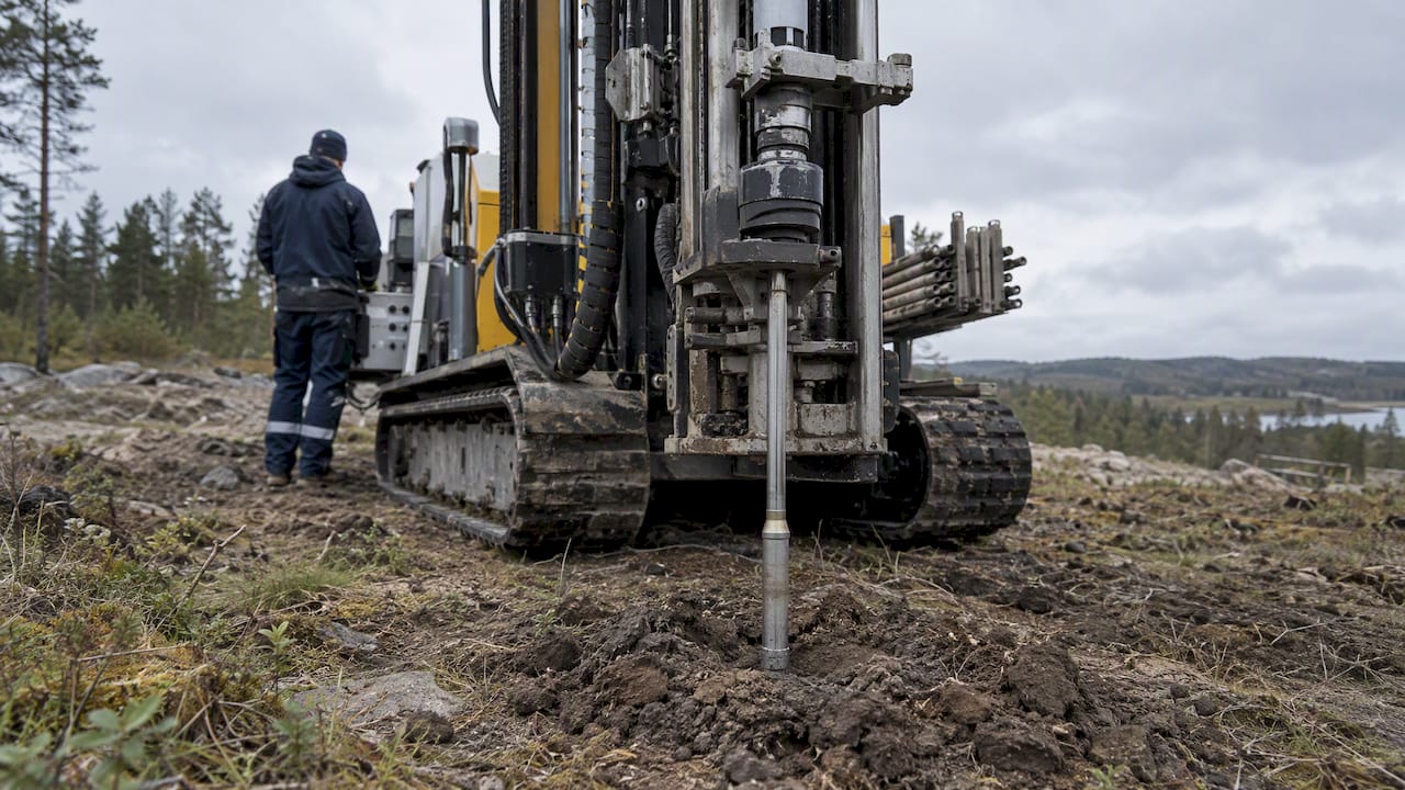 CPTu rig advancing a sounding rod into soil