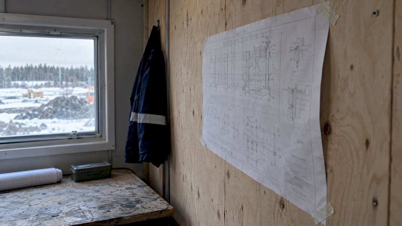 Superseded drawing taped inside site trailer