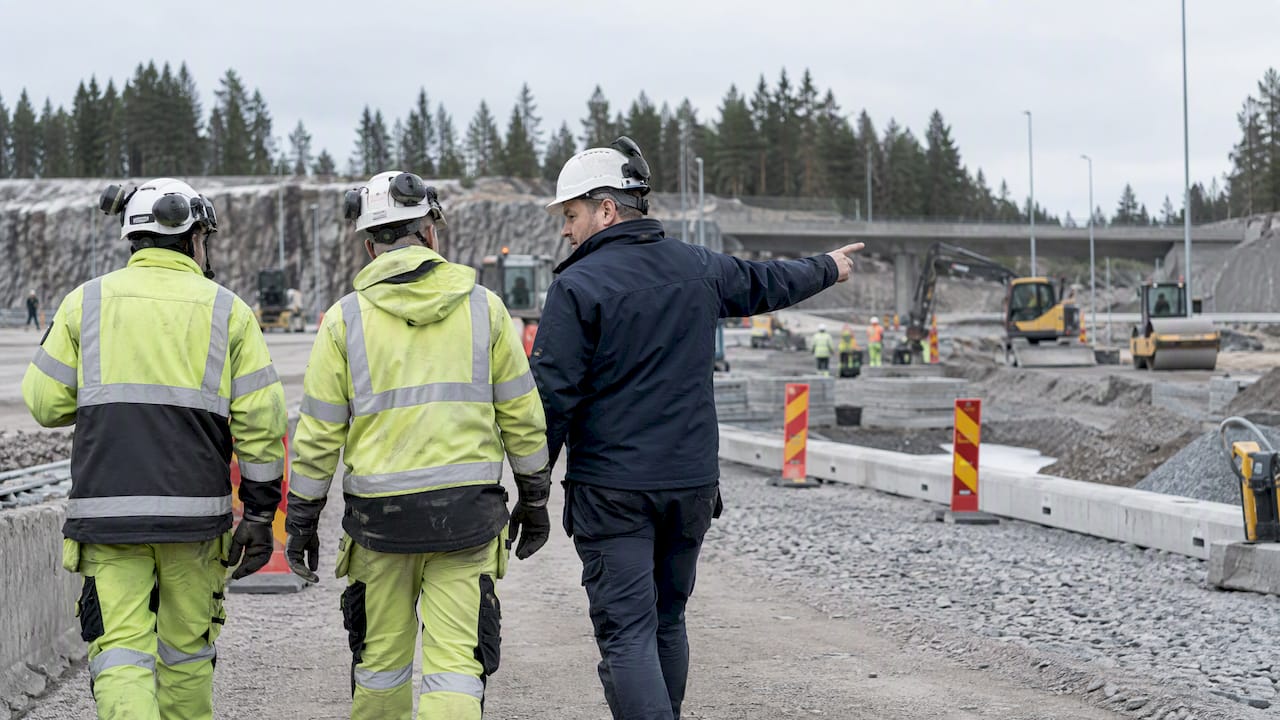 Construction crew reviewing work sequence on site