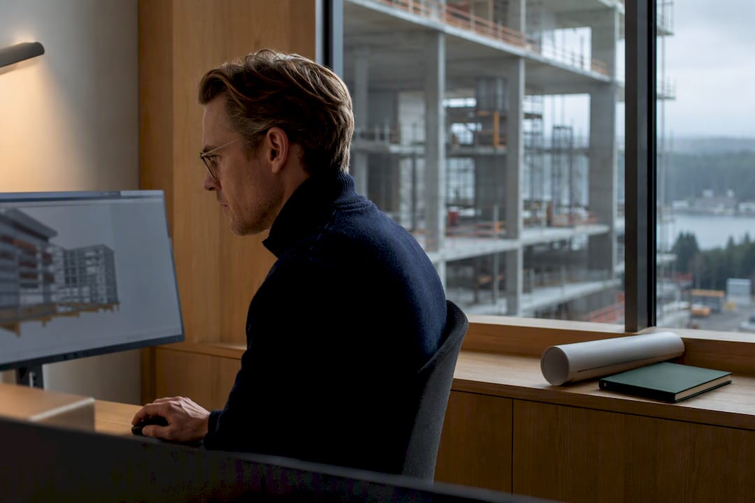 Engineer validating a BIM model in Nordic office